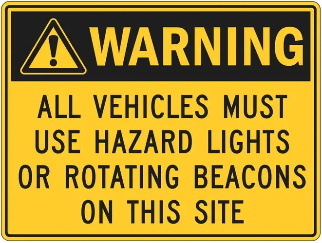 SIGN- WARNING ALL VECHICLES MUST USE HAZARD LIGHTS OR ROTATION BEACONS ON THIS SITE (POLY 600 X 400M